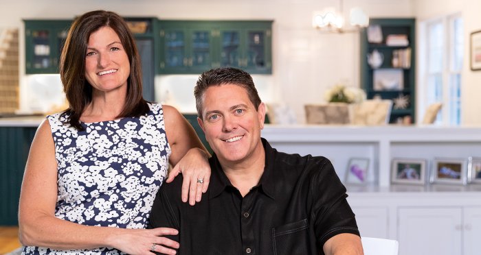 Investing $1,000,000 or below Woman and man smiling and sitting side by side